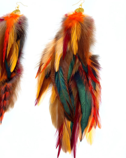 Luxurious Autumn's Gaze Long Feather Earrings with Warm Orange and Brown Tones and Gold moon Pendant.