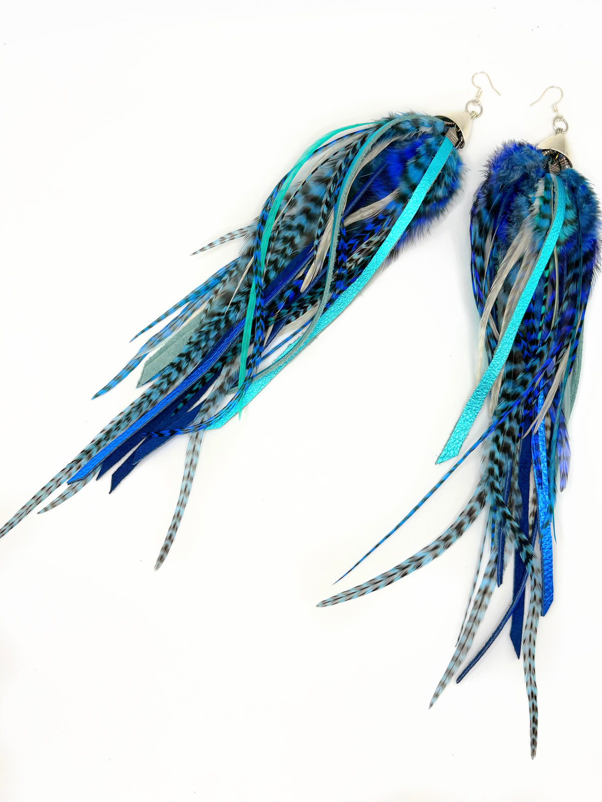 Extra-long bohemian feather and leather earrings with navy blue, turquoise and white rooster feathers, metallic leather accents and silver caps, handmade in Brooklyn.