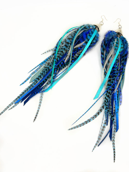 Extra-long bohemian feather and leather earrings with navy blue, turquoise and white rooster feathers, metallic leather accents and silver caps, handmade in Brooklyn.