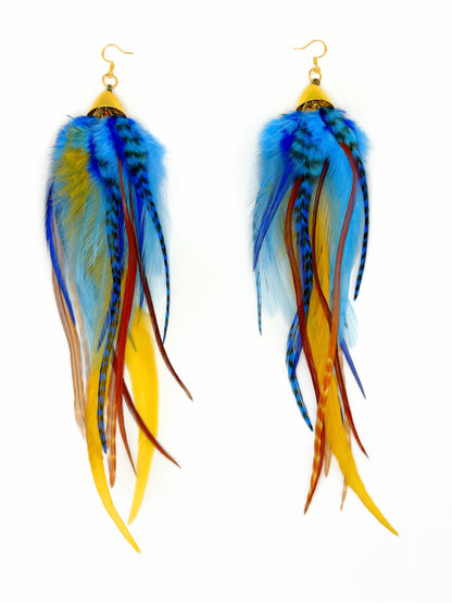 Long bohemian feather earrings with navy blue, light blue, golden yellow, brown and beige rooster feathers cascading from gold cap pendants, handmade in Brooklyn.