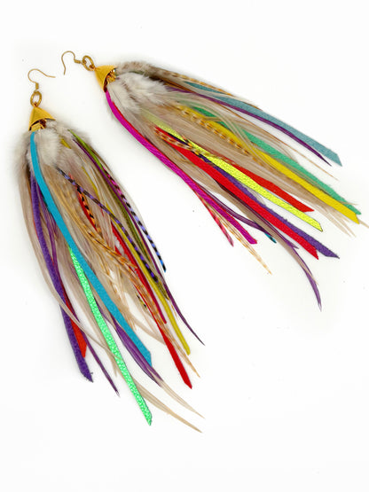 Colorful feather earrings on a white background