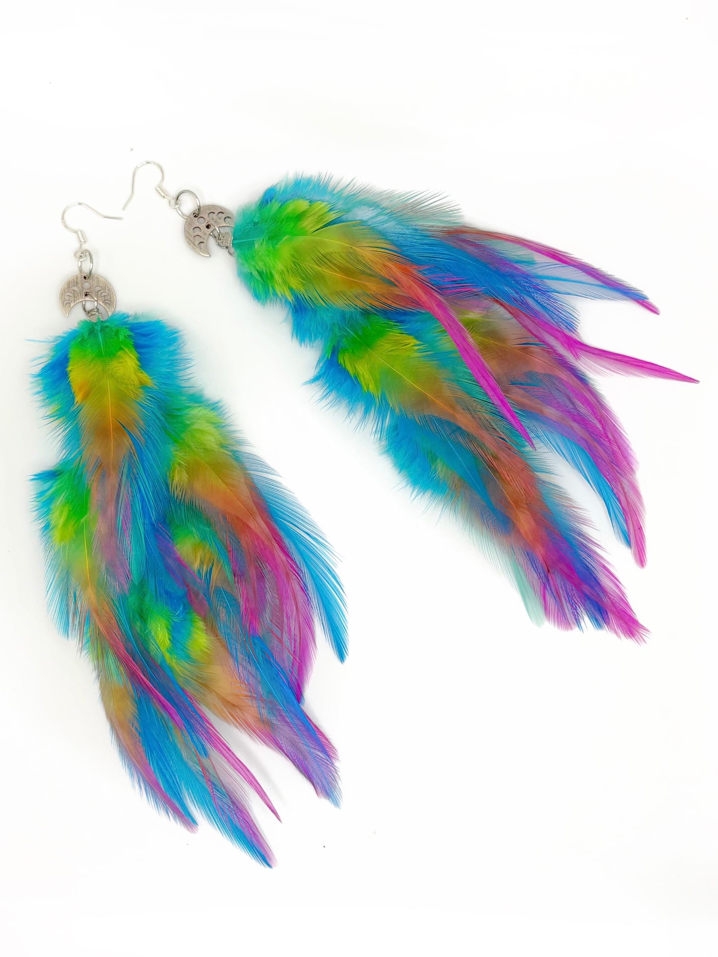 Colorful feather earrings on a white background