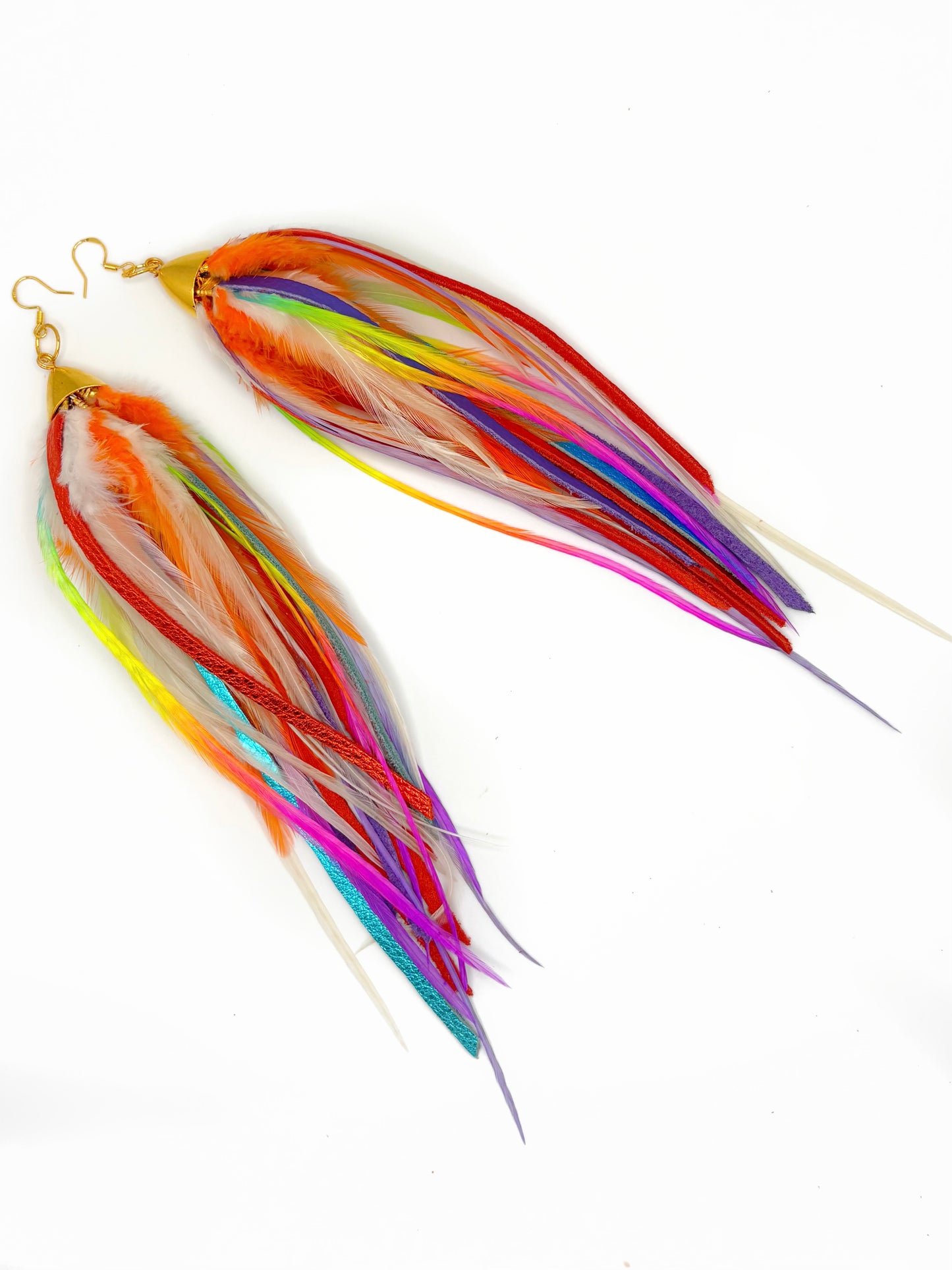 Colorful feather earrings on a white background