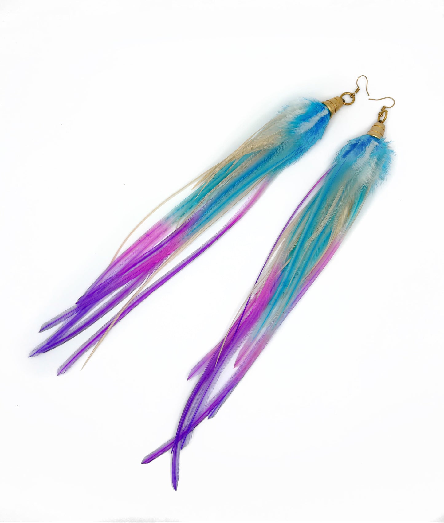 Long feather earrings in white, purple and blue.