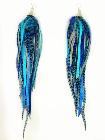 Extra-long bohemian feather and leather earrings with navy blue, turquoise and white rooster feathers, metallic leather accents and silver caps, handmade in Brooklyn.