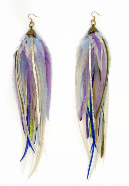 Long feather and leather earrings in cream, purple and green tones. 