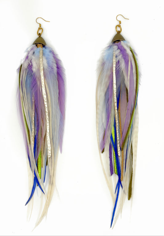 Long feather and leather earrings in cream, purple and green tones. 