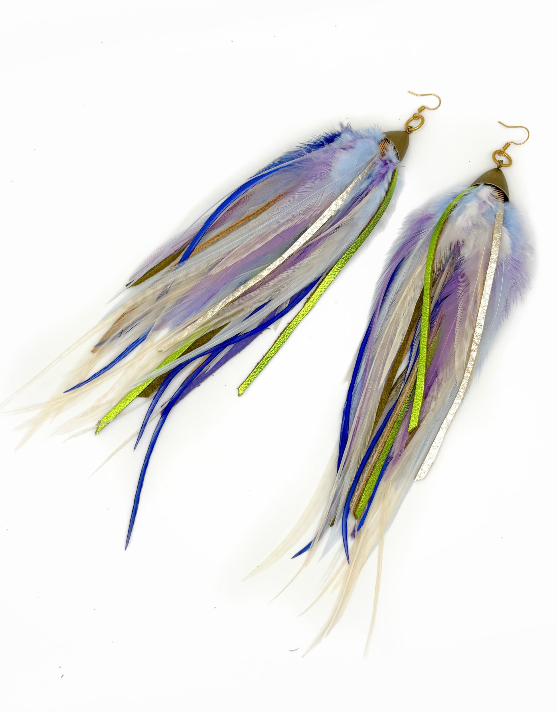 Long feather and leather earrings in cream, purple and green tones. 