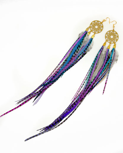 Feather earrings with gold dreamcatcher design on a white background