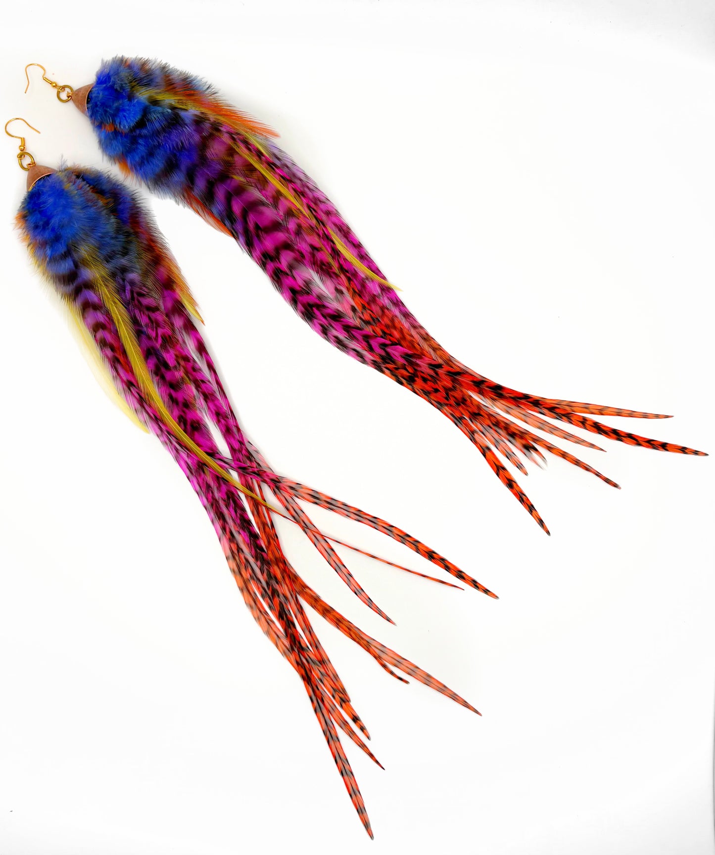 Colorful feather earrings on a white background