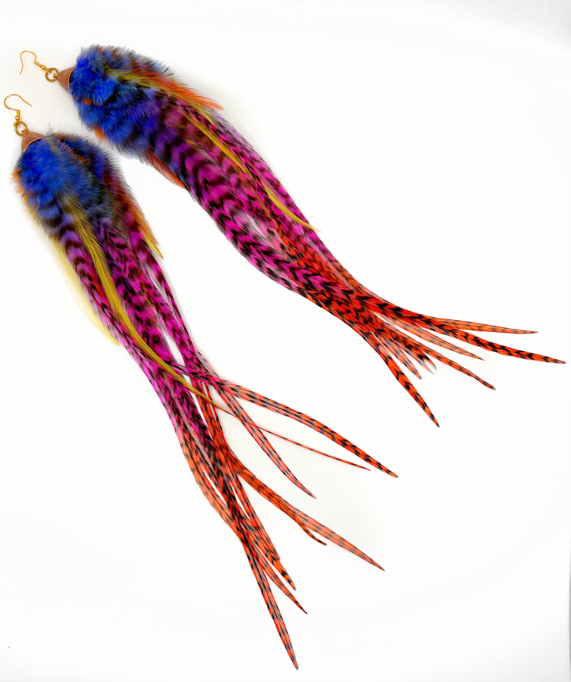 Colorful feather earrings on a white background