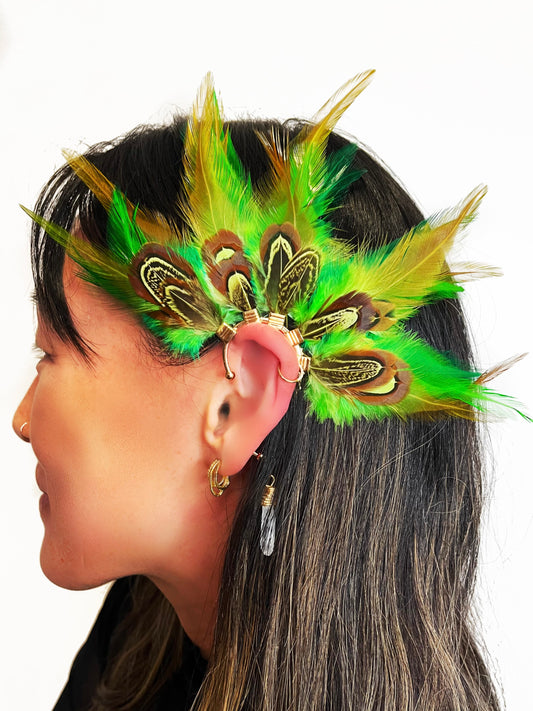 Vibrant green rooster feather ear cuff with brown green pheasant feathers modeled on a woman.