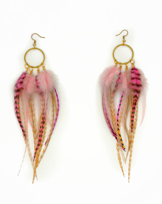 Feather earrings with pink and gold accents on a white background