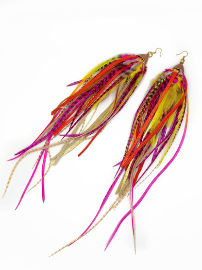 Colorful fishing lures with feathers on a white background