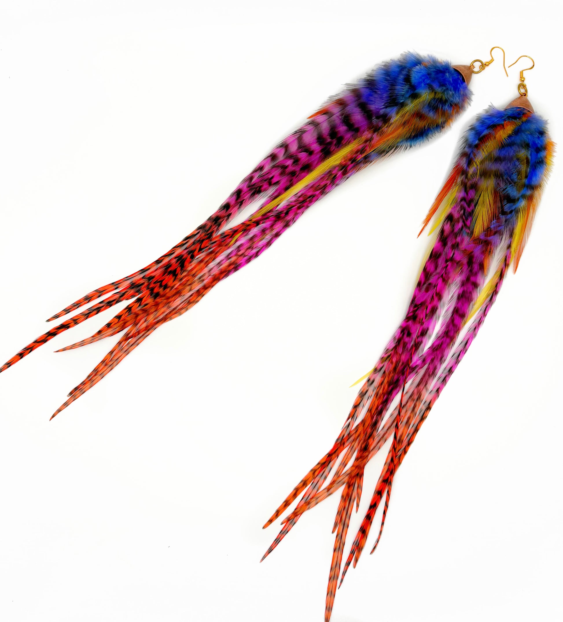 Colorful feather earrings on a white background