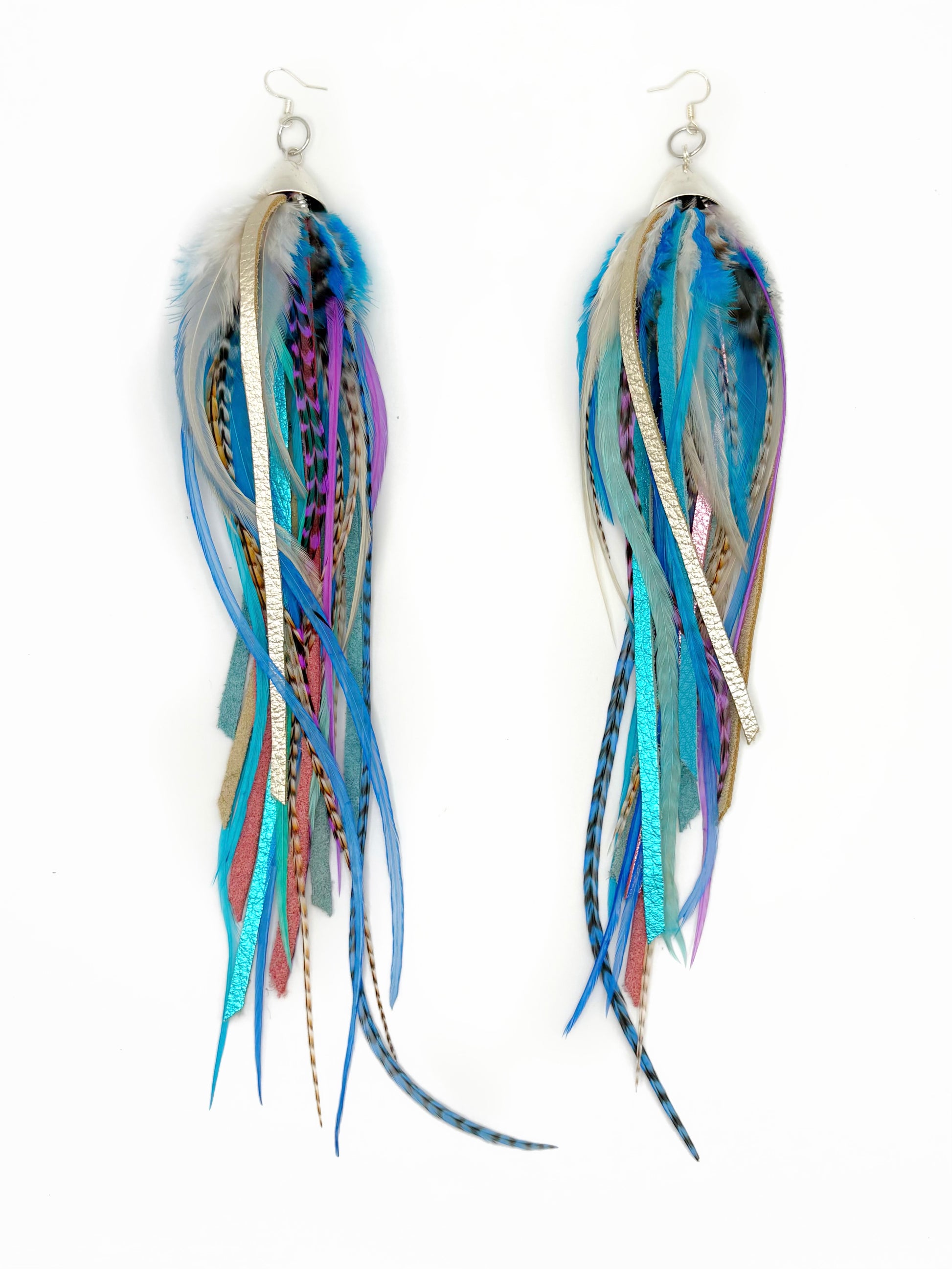 Multicolored feather earrings on a white background