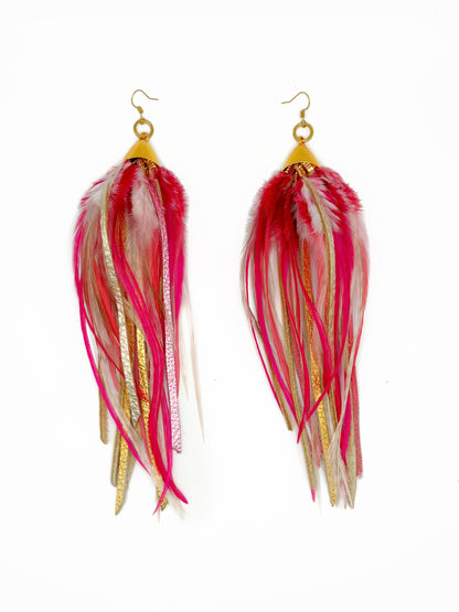 Pink and gold feather and leather earrings.