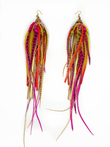 Colorful feathered earrings on a white background