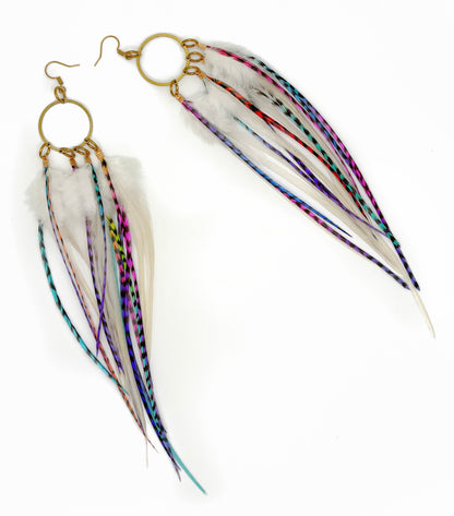 Feather earrings with gold hooks on a white background