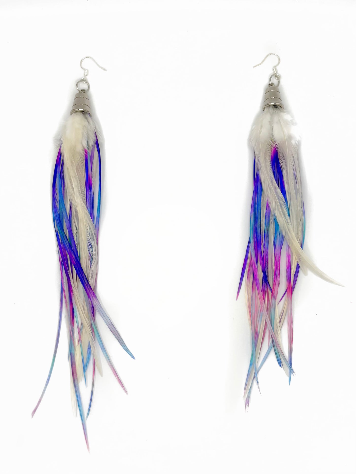 Pair of earrings with multicolored feather-like strands on a white background