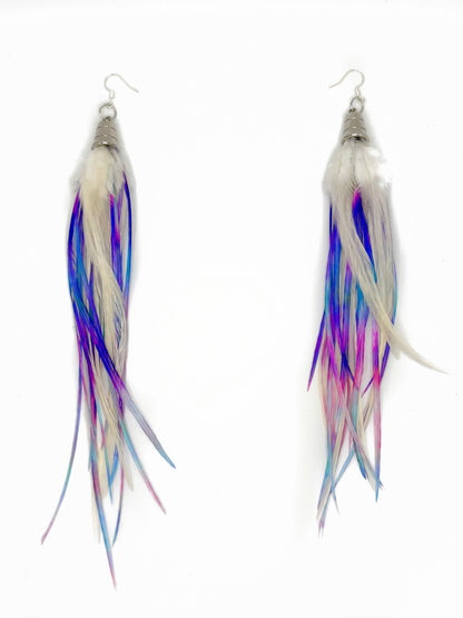 Pair of earrings with multicolored feather-like strands on a white background