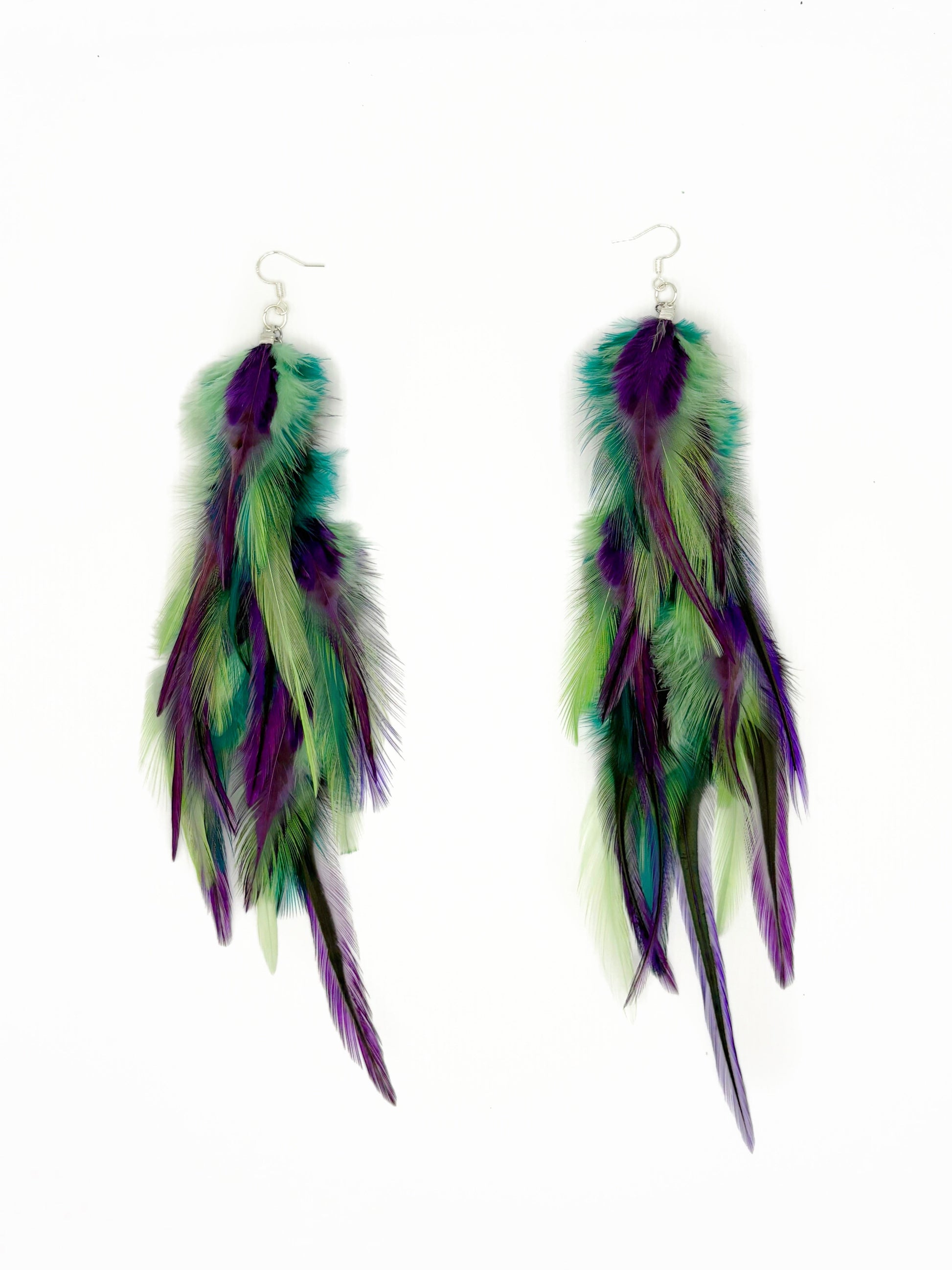 Long green and purple feather earrings. 